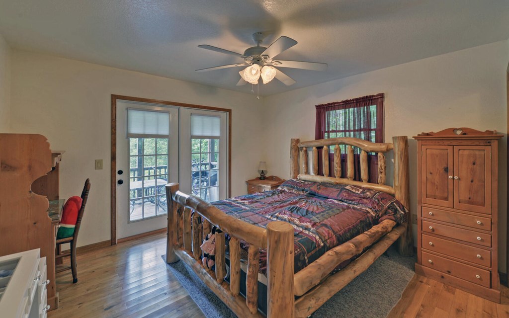 56 Waxwing Trail Murphy, NC 28906 - Photo 15 of 49 a bedroom with a bed and wooden floor