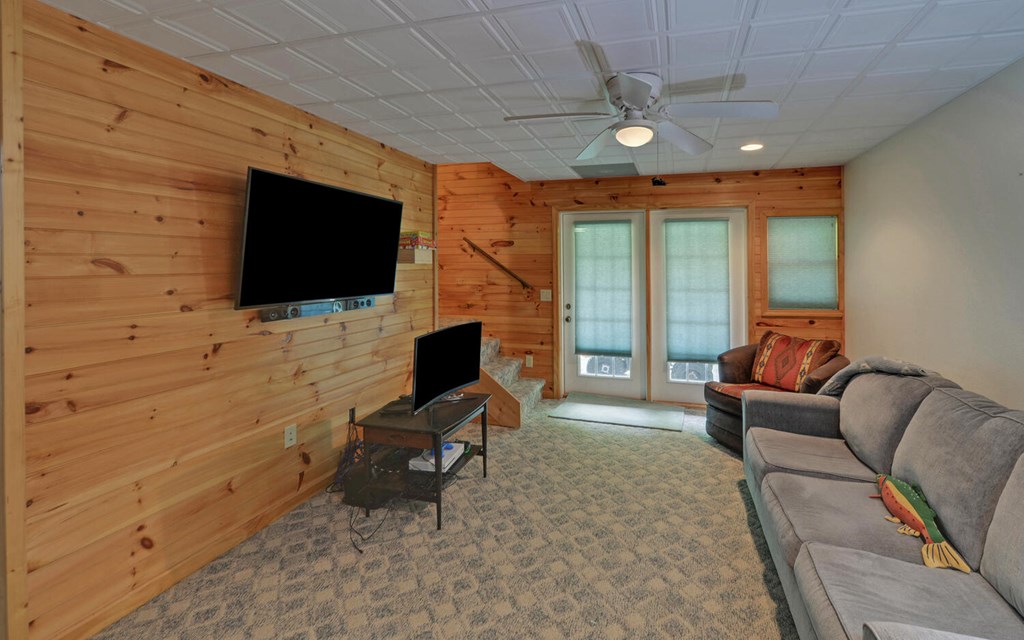 56 Waxwing Trail Murphy, NC 28906 - Photo 29 of 49 a living room with furniture and a flat screen tv