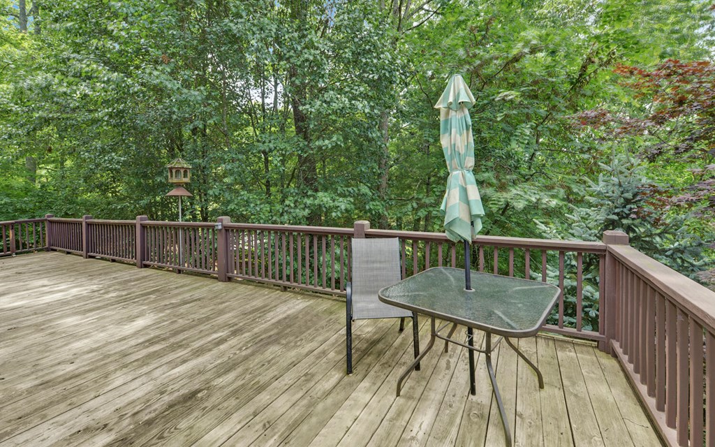 56 Waxwing Trail Murphy, NC 28906 - Photo 39 of 49 a view of balcony with wooden floor and outdoor seating