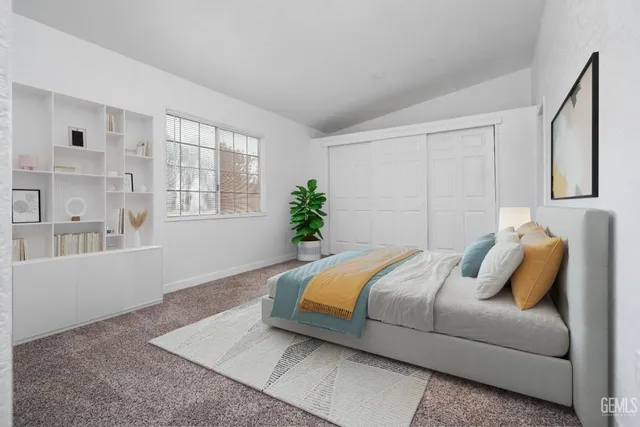 a bedroom with a bed and window