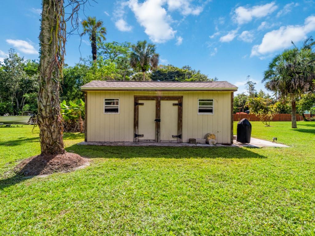 5300 Cypress Lane Naples, FL 34113 - Photo 5 of 14 a view of a house with a backyard