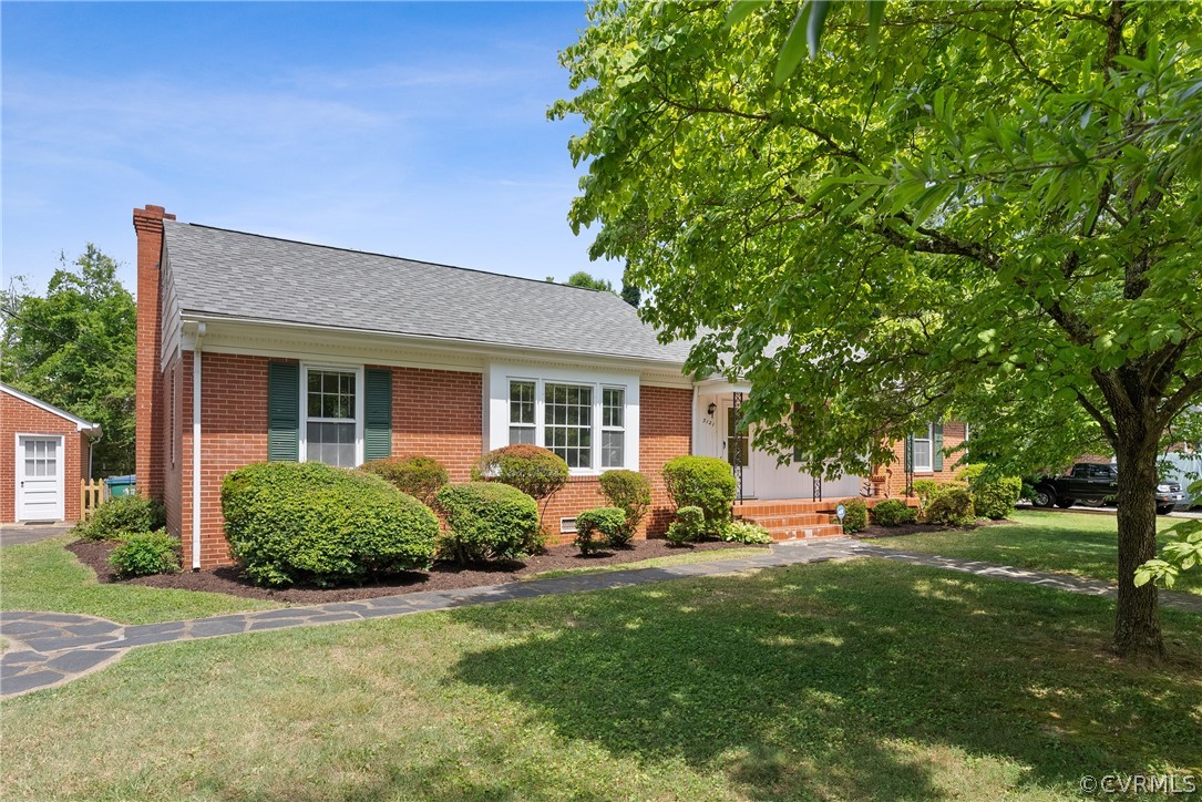 3121 Yukon Road Richmond, VA 23235 - Photo 1 of 27 a front view of a house with garden