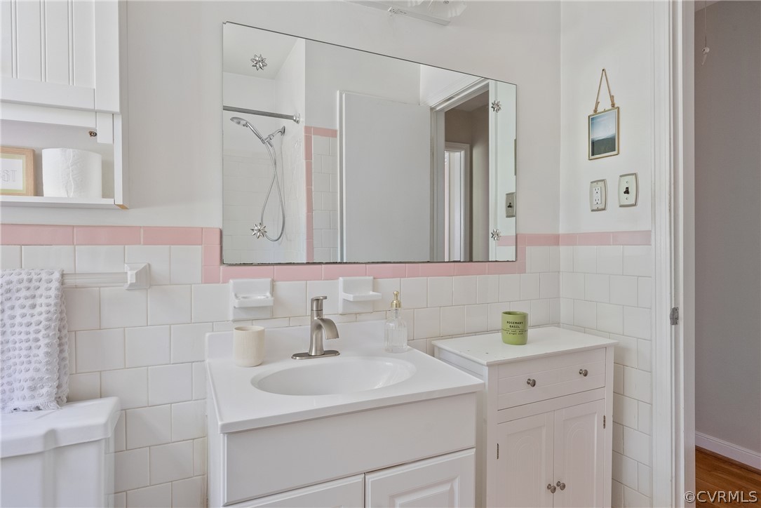 3121 Yukon Road Richmond, VA 23235 - Photo 19 of 27 a bathroom with a sink and a mirror