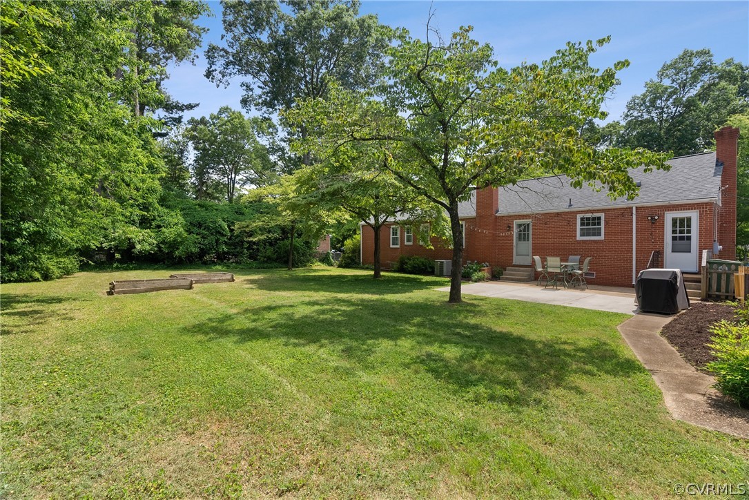 3121 Yukon Road Richmond, VA 23235 - Photo 2 of 27 a view of a house with backyard and a tree