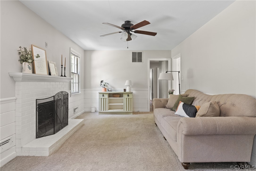 3121 Yukon Road Richmond, VA 23235 - Photo 7 of 27 a living room with furniture and a fireplace