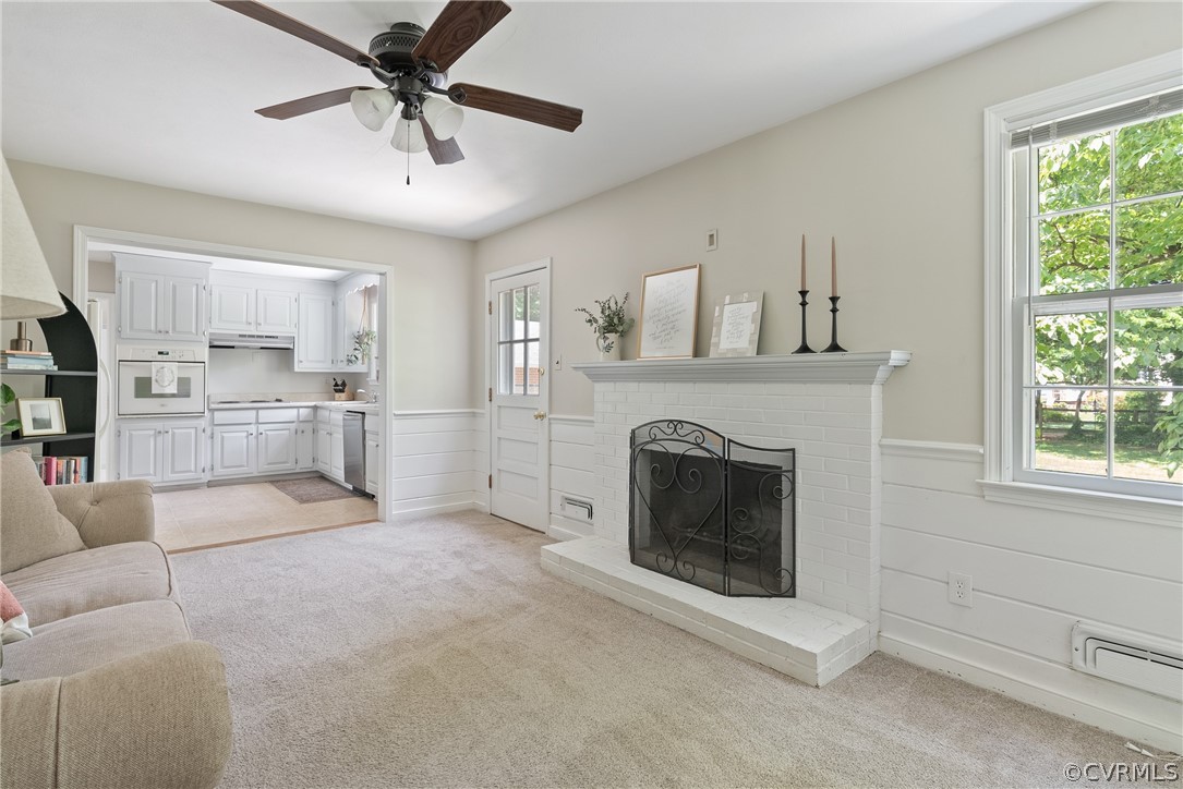 3121 Yukon Road Richmond, VA 23235 - Photo 8 of 27 a living room with furniture and a fireplace