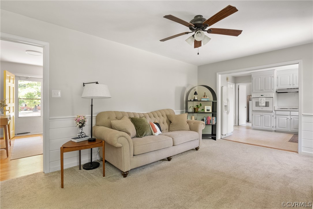 3121 Yukon Road Richmond, VA 23235 - Photo 9 of 27 a living room with furniture and a chandelier