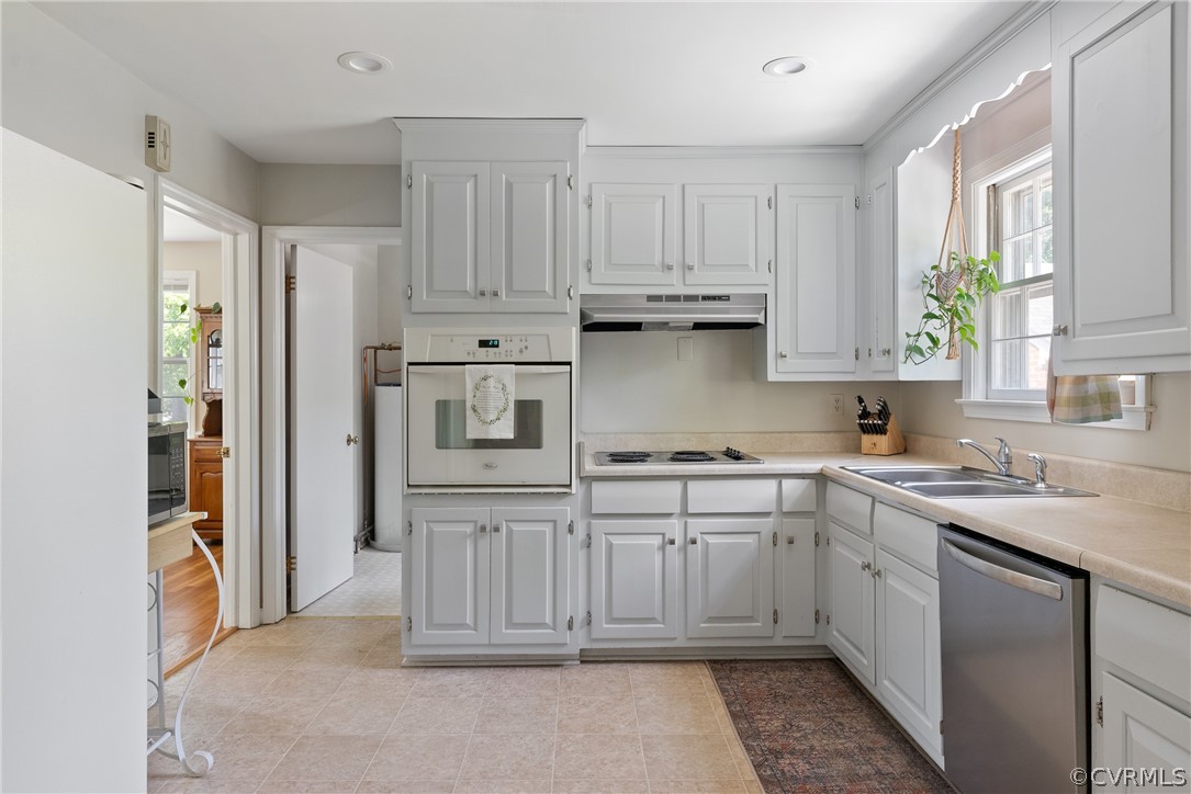 3121 Yukon Road Richmond, VA 23235 - Photo 10 of 27 a kitchen with stainless steel appliances granite countertop a refrigerator sink and cabinets