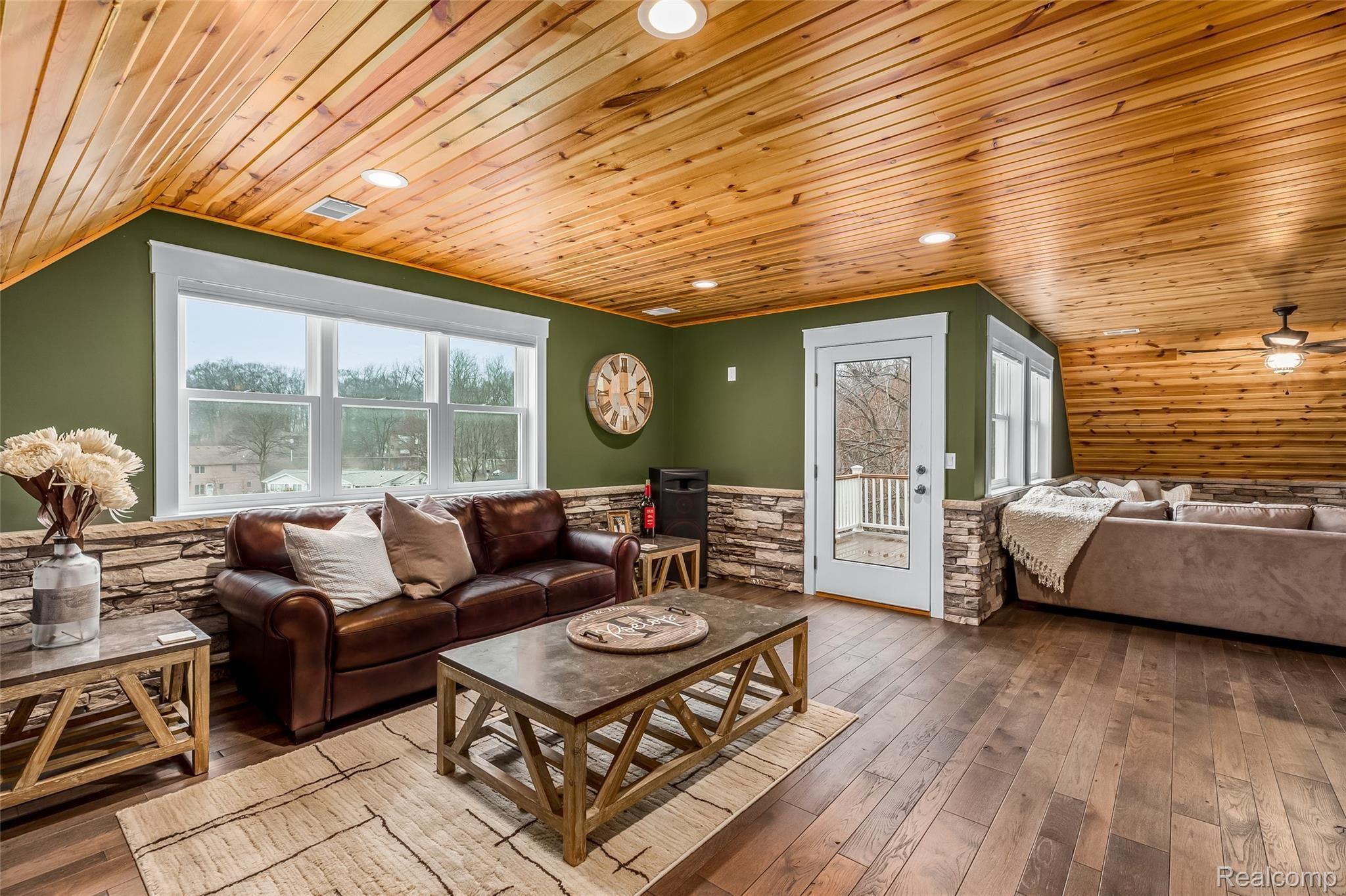 10136 Buhl Road Pinckney, MI 48169 - Photo 41 of 54 Walk out access to the third floor deck overlooking the lake