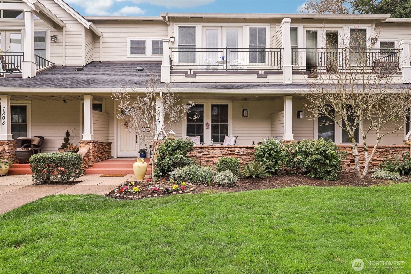 7812 Northwest Quinault Street, Unit 5 Camas, WA 98607 - Photo 1 of 40 a front view of a building with garden