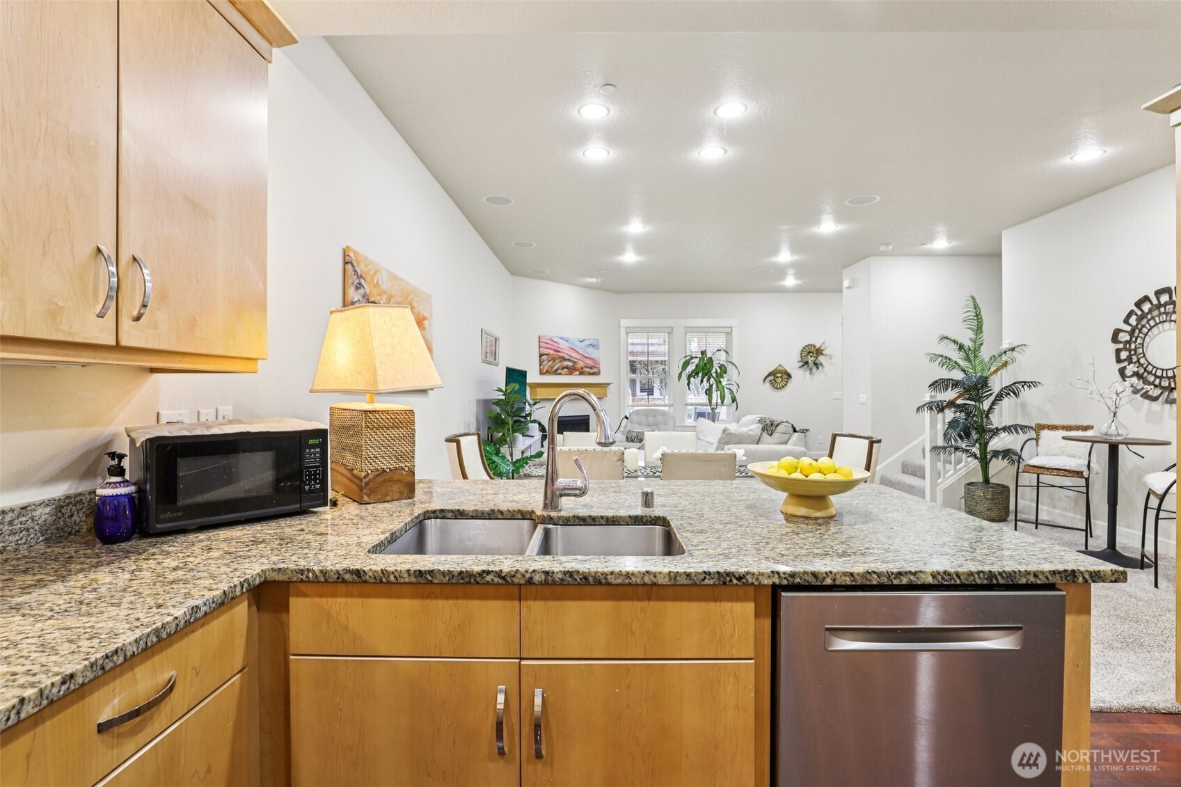 7812 Northwest Quinault Street, Unit 5 Camas, WA 98607 - Photo 12 of 40 a kitchen with granite countertop a sink a stove and cabinets