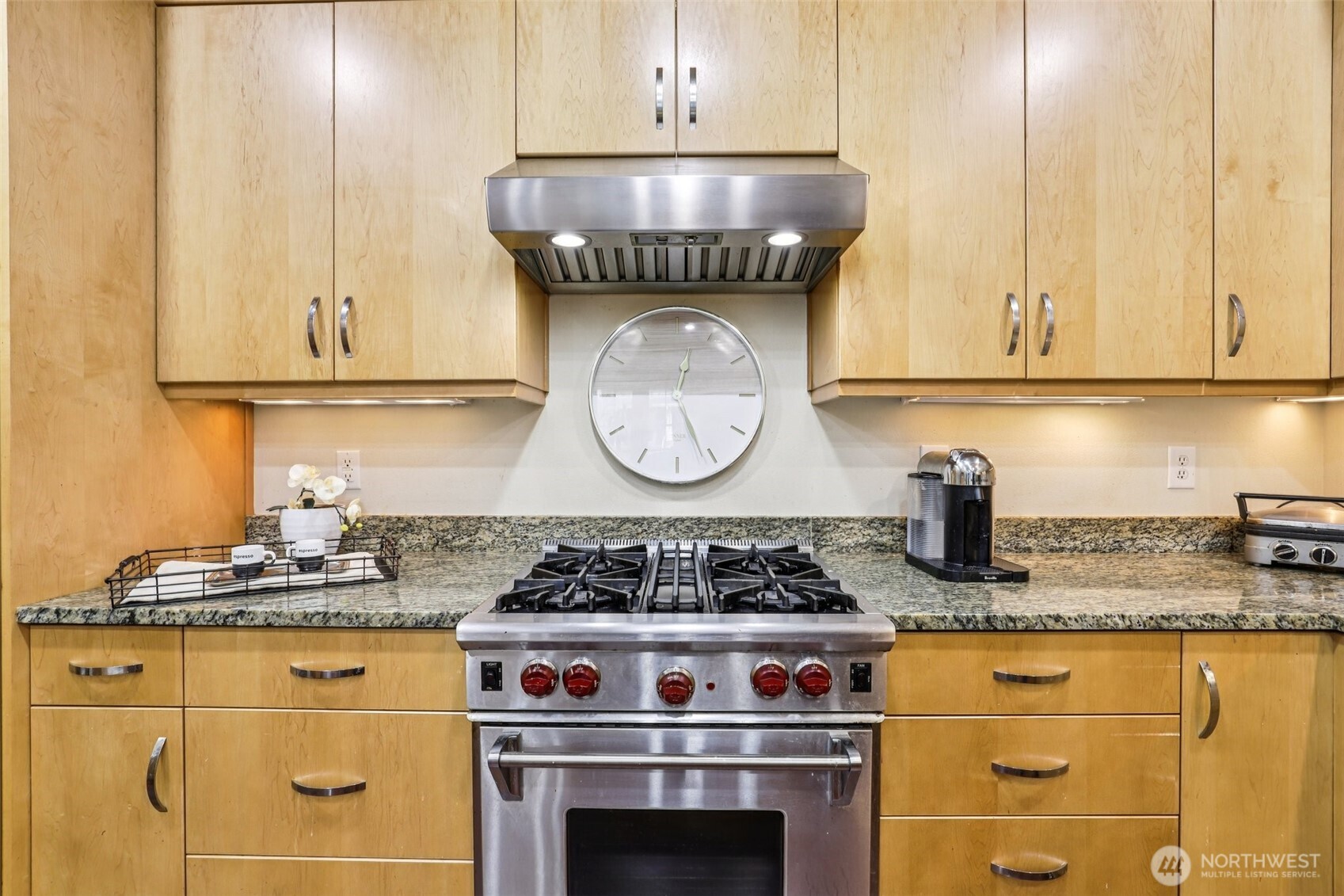 7812 Northwest Quinault Street, Unit 5 Camas, WA 98607 - Photo 14 of 40 a kitchen with granite countertop a stove a sink and a granite counter tops