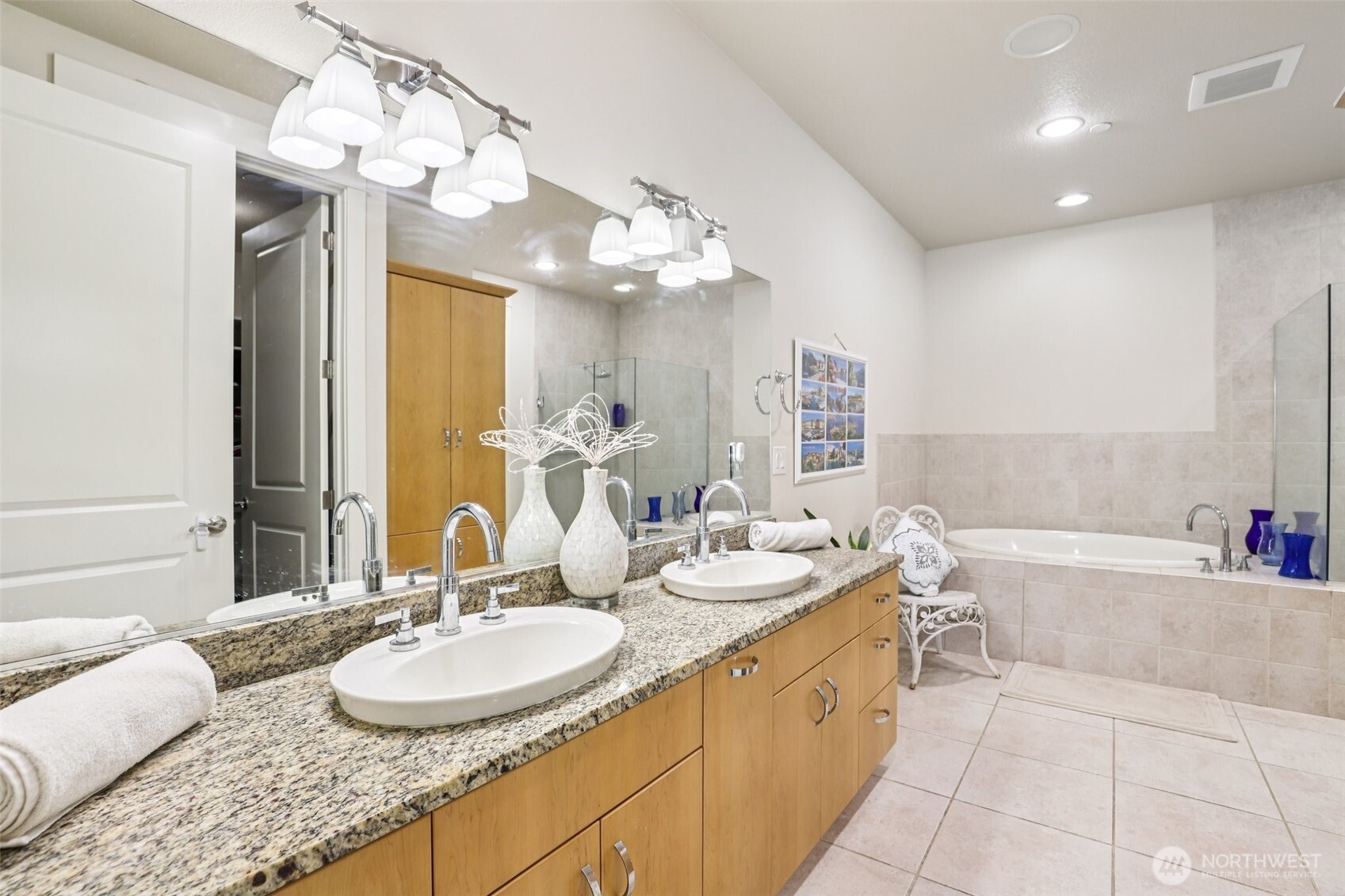 7812 Northwest Quinault Street, Unit 5 Camas, WA 98607 - Photo 23 of 40 a spacious bathroom with a granite countertop double vanity sink mirror and bathtub