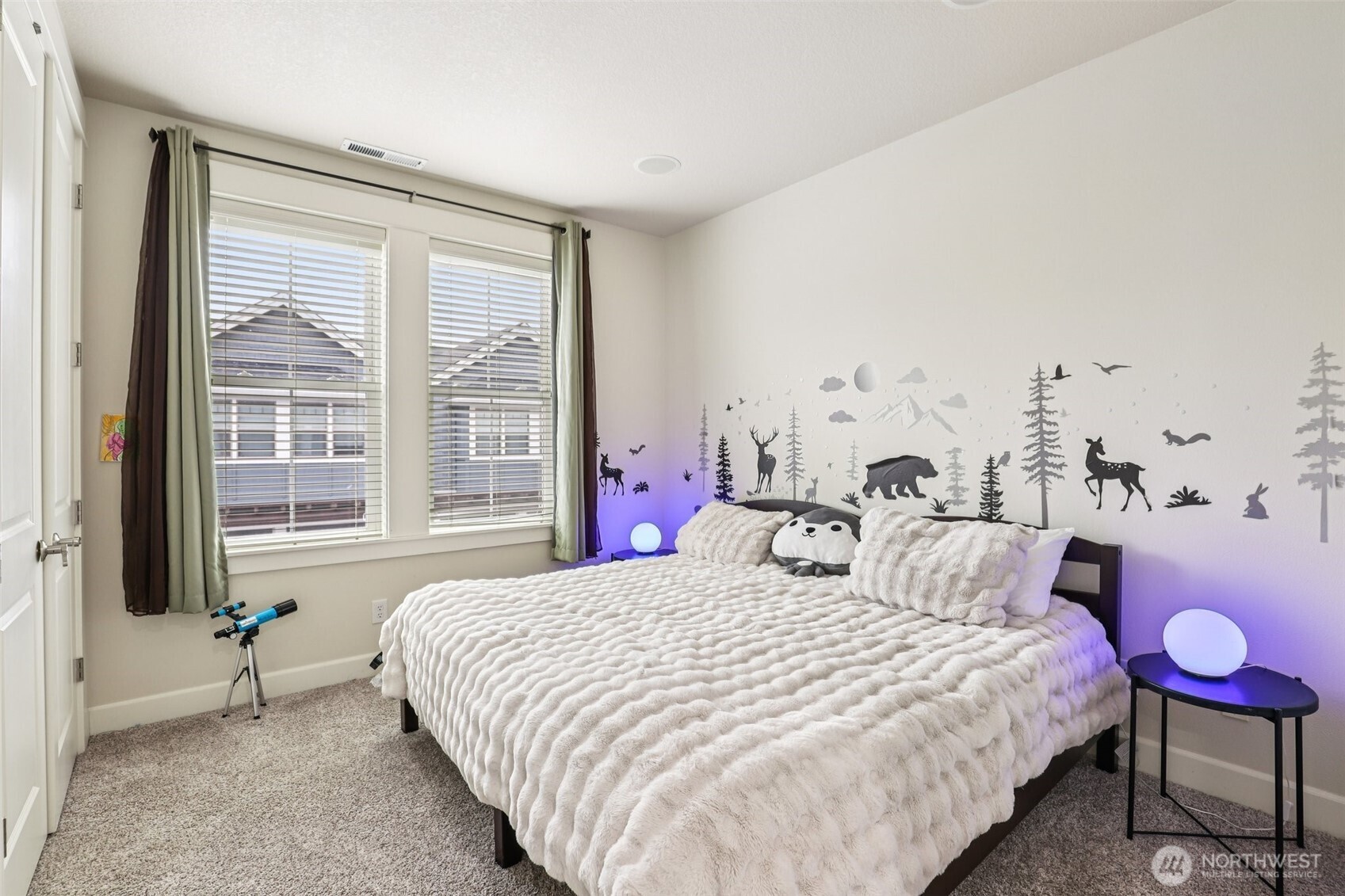 7812 Northwest Quinault Street, Unit 5 Camas, WA 98607 - Photo 27 of 40 a bedroom with bed and large windows