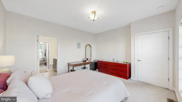 a bedroom with bed and a dresser