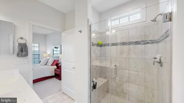a en suite bathroom with a sink and a shower