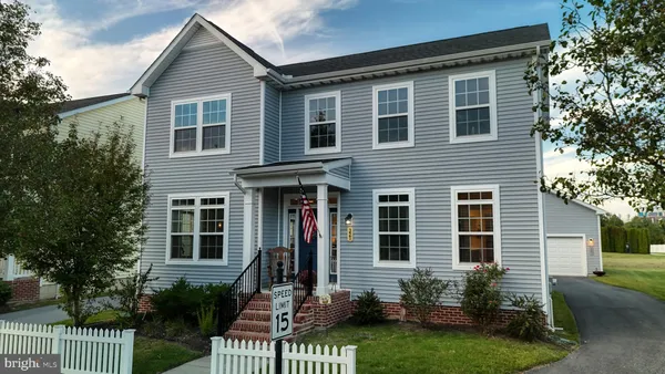 a view of a house with a yard and plants