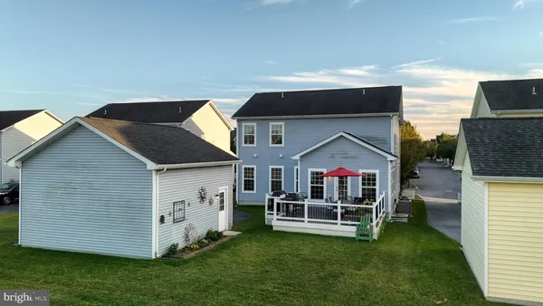 a front view of a house with a yard table and chairs