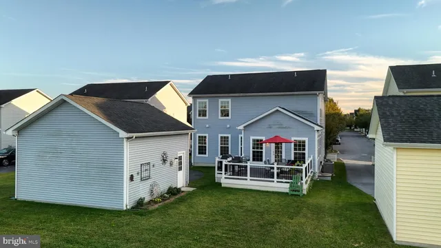 a front view of a house with a yard table and chairs