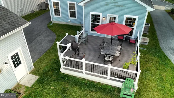 a view of multiple houses with swimming pool
