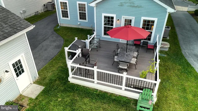 a view of multiple houses with swimming pool