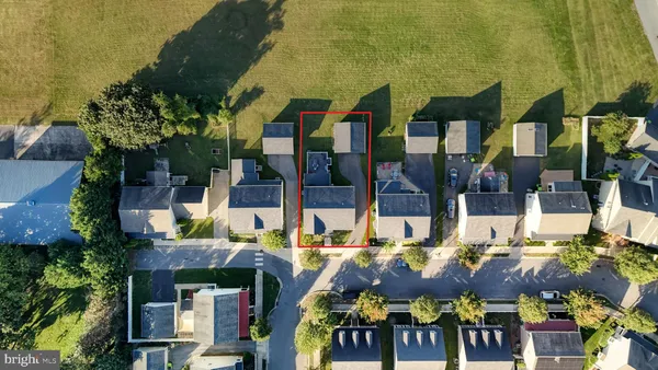 an aerial view of a house with a garden and plants