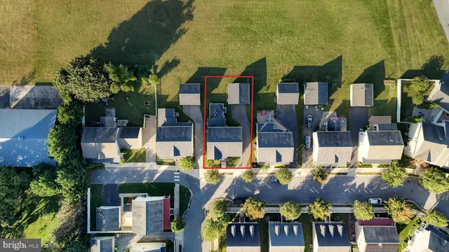 an aerial view of a house with a garden and plants