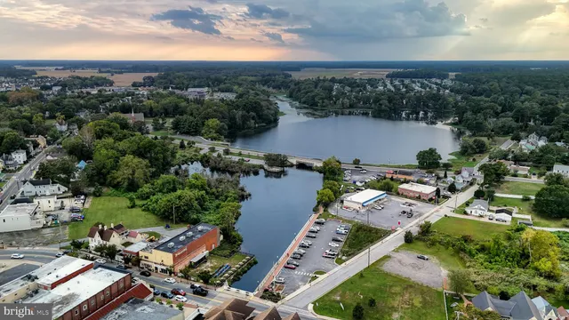 a city street lined with buildings and cars