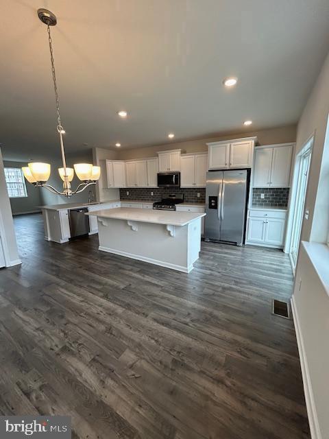 34 Rome Way Mount Laurel, NJ 08054 - Photo 2 of 25 a view of a kitchen with kitchen island a sink wooden floor and a living room view