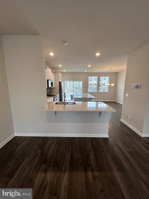 34 Rome Way Mount Laurel, NJ 08054 - Photo 4 of 25 a view of a kitchen with a sink and dishwasher with wooden floor