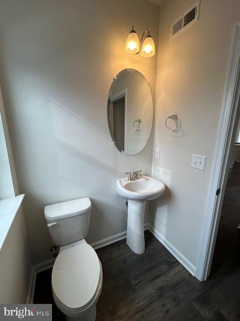 34 Rome Way Mount Laurel, NJ 08054 - Photo 10 of 25 a white toilet sitting next to a bathroom sink