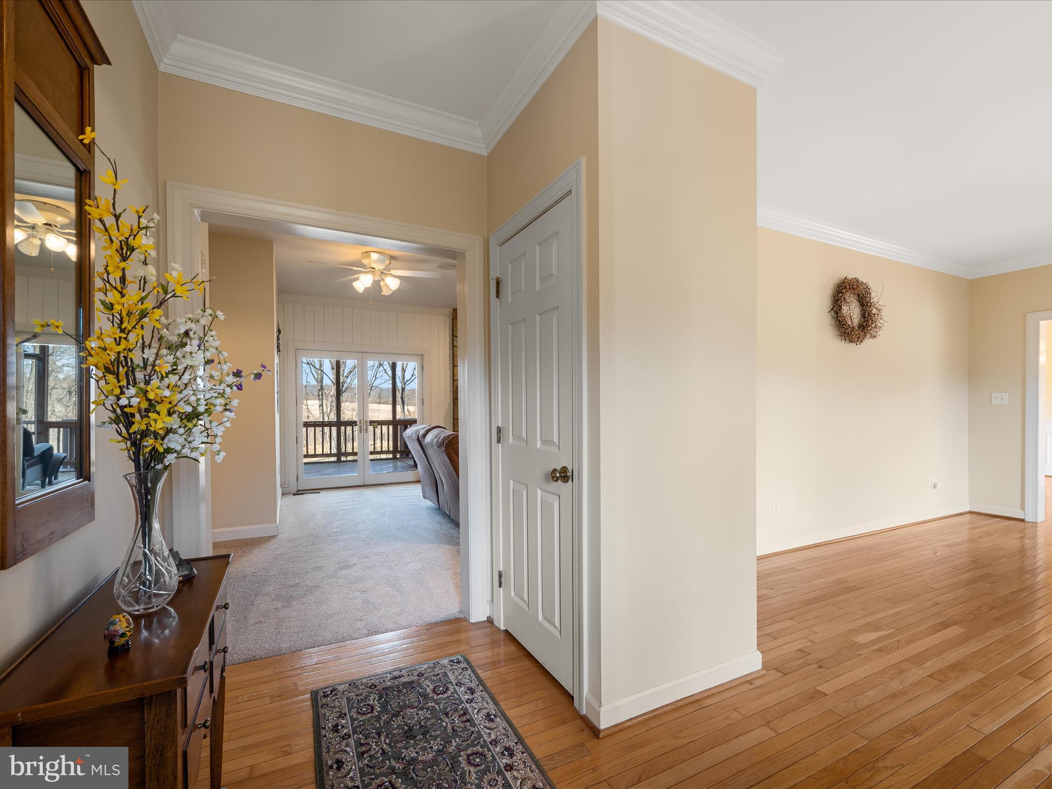 41950 Saddlebrook Place Leesburg, VA 20176 - Photo 16 of 87 a view of a hallway with wooden floor and a potted plant