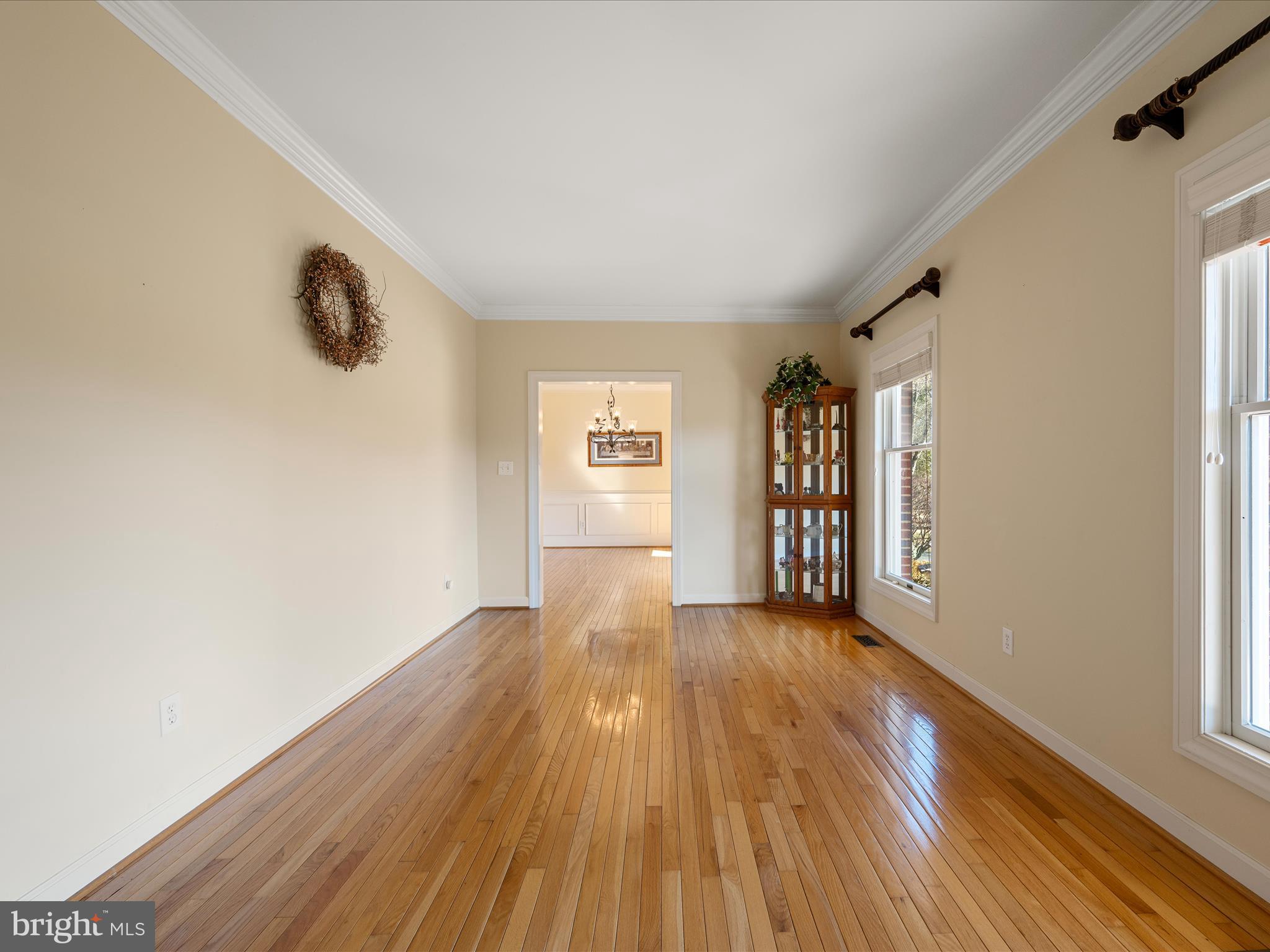 41950 Saddlebrook Place Leesburg, VA 20176 - Photo 17 of 87 a view of an empty room with wooden floor and a window