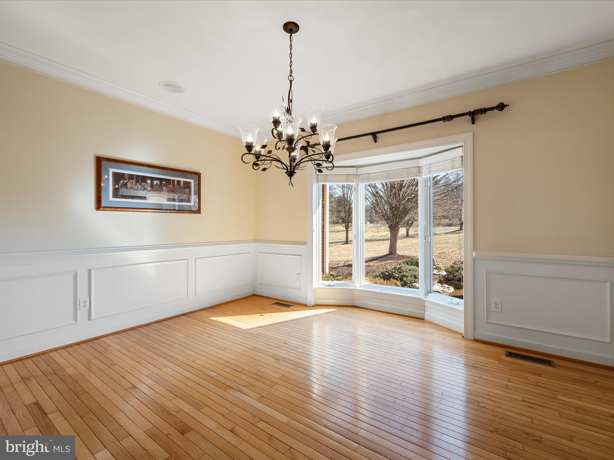 41950 Saddlebrook Place Leesburg, VA 20176 - Photo 19 of 87 a view of a livingroom with wooden floor a ceiling fan and windows