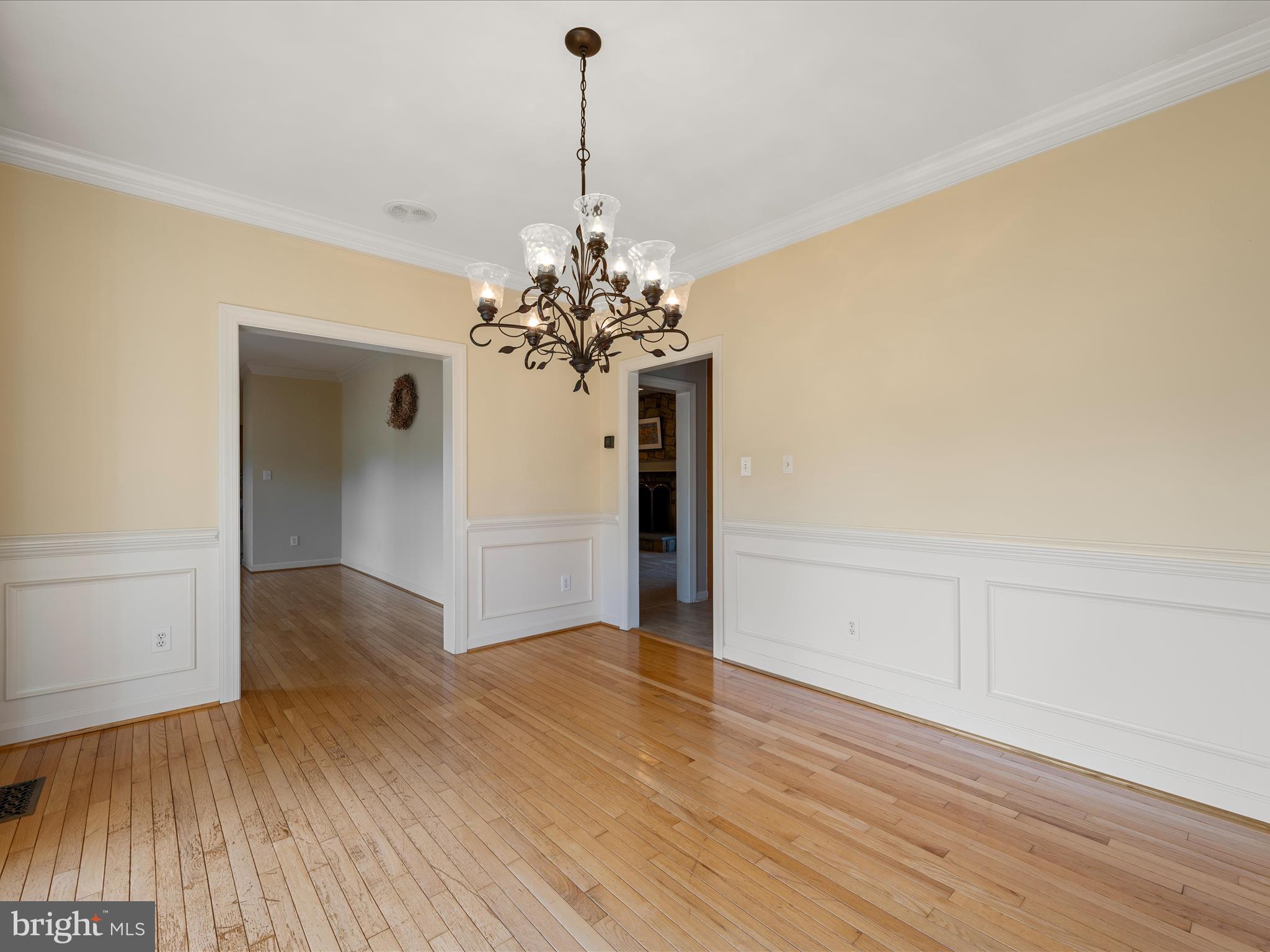 41950 Saddlebrook Place Leesburg, VA 20176 - Photo 20 of 87 a view of a room with wooden floor and chandelier