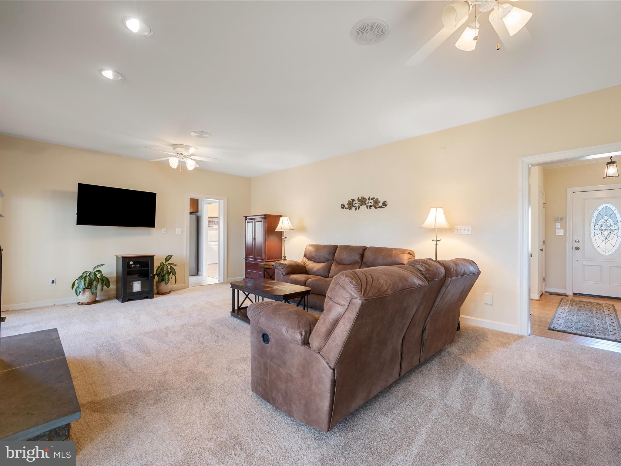 41950 Saddlebrook Place Leesburg, VA 20176 - Photo 24 of 87 a living room with furniture and a flat screen tv