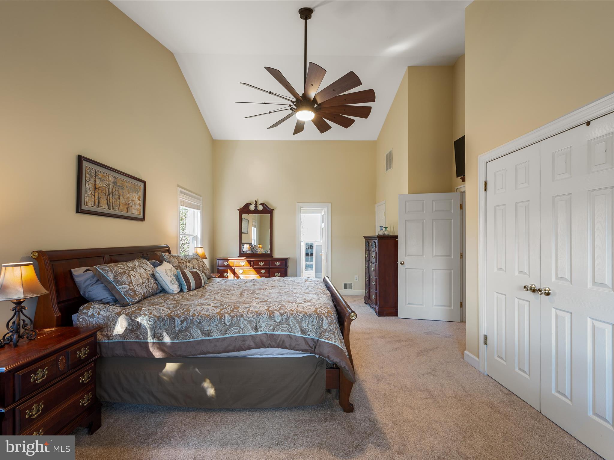 41950 Saddlebrook Place Leesburg, VA 20176 - Photo 33 of 87 a bedroom with a bed and ceiling fan