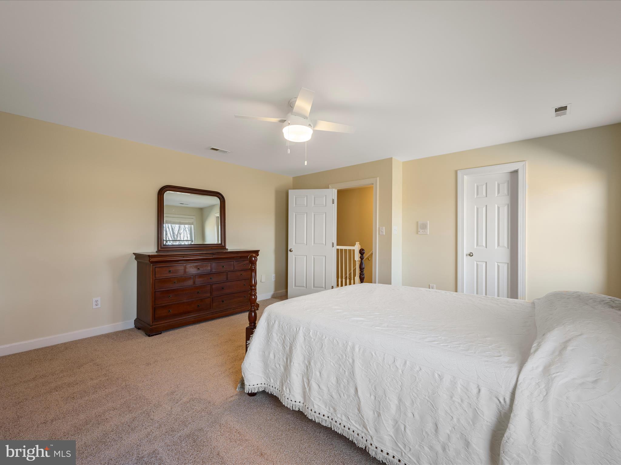 41950 Saddlebrook Place Leesburg, VA 20176 - Photo 45 of 87 a bedroom with a bed and a dresser