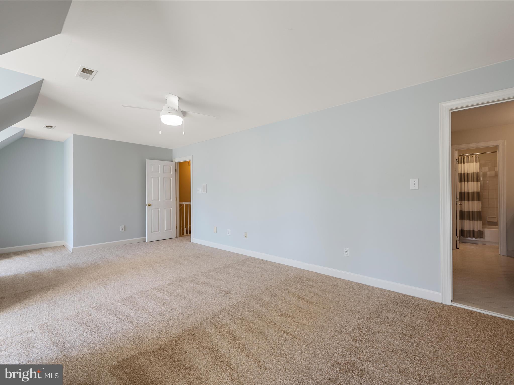 41950 Saddlebrook Place Leesburg, VA 20176 - Photo 48 of 87 a view of an empty room with a ceiling fan