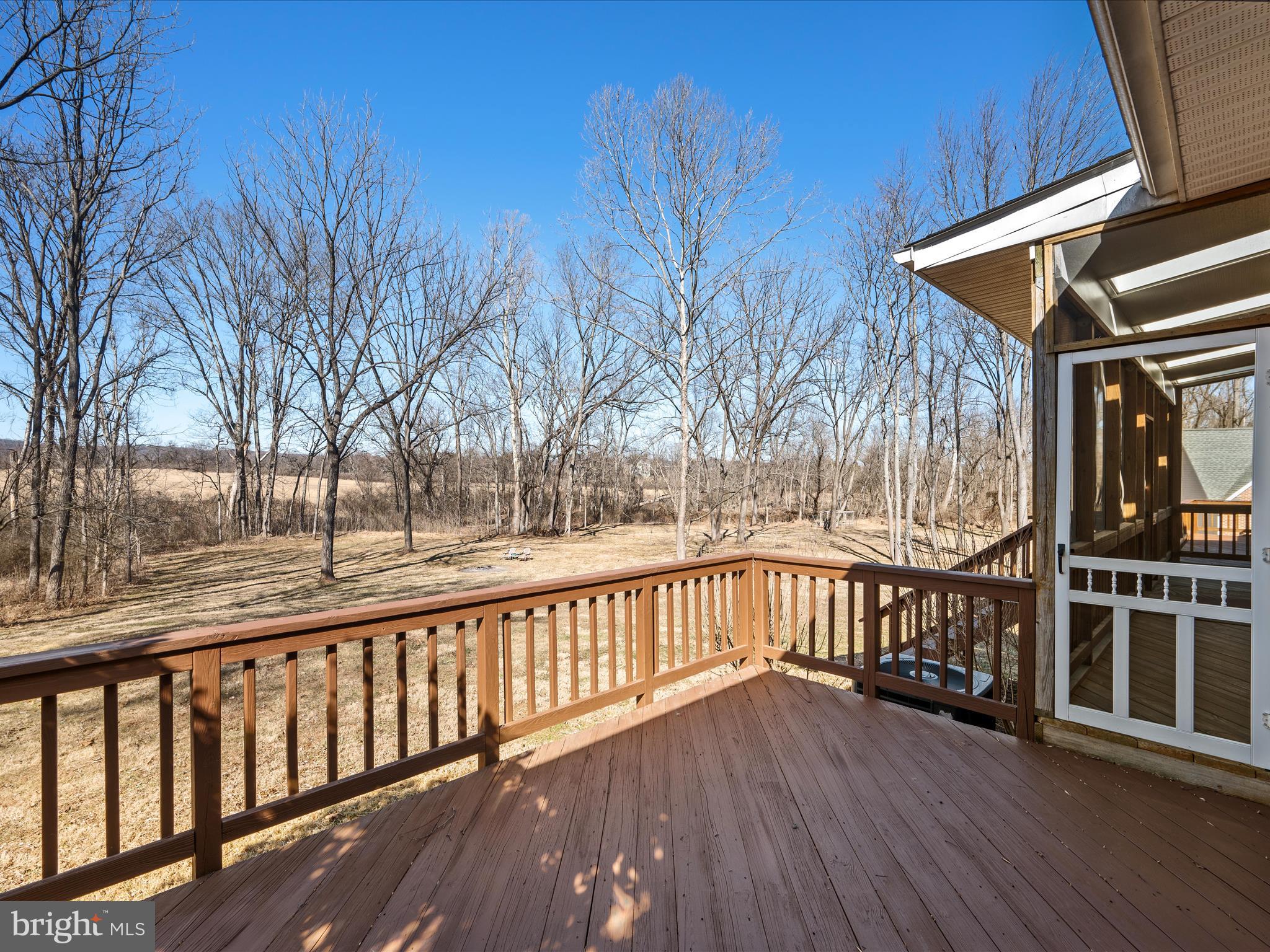 41950 Saddlebrook Place Leesburg, VA 20176 - Photo 56 of 87 a view of a balcony with wooden floor and fence