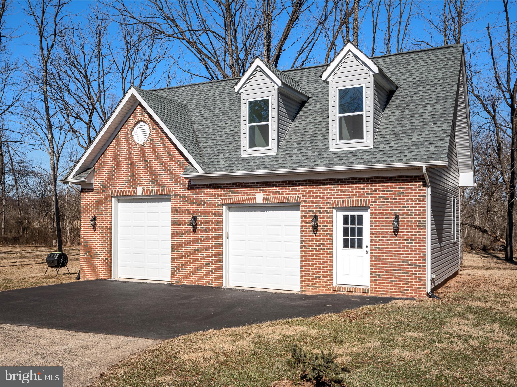41950 Saddlebrook Place Leesburg, VA 20176 - Photo 68 of 87 a front view of a house with a yard and garage