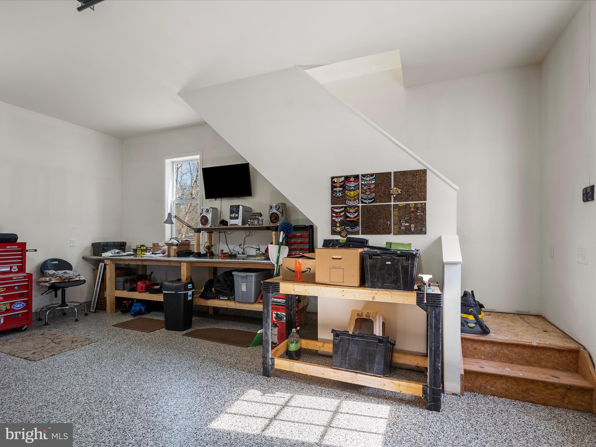 41950 Saddlebrook Place Leesburg, VA 20176 - Photo 71 of 87 a living room with furniture and a flat screen tv