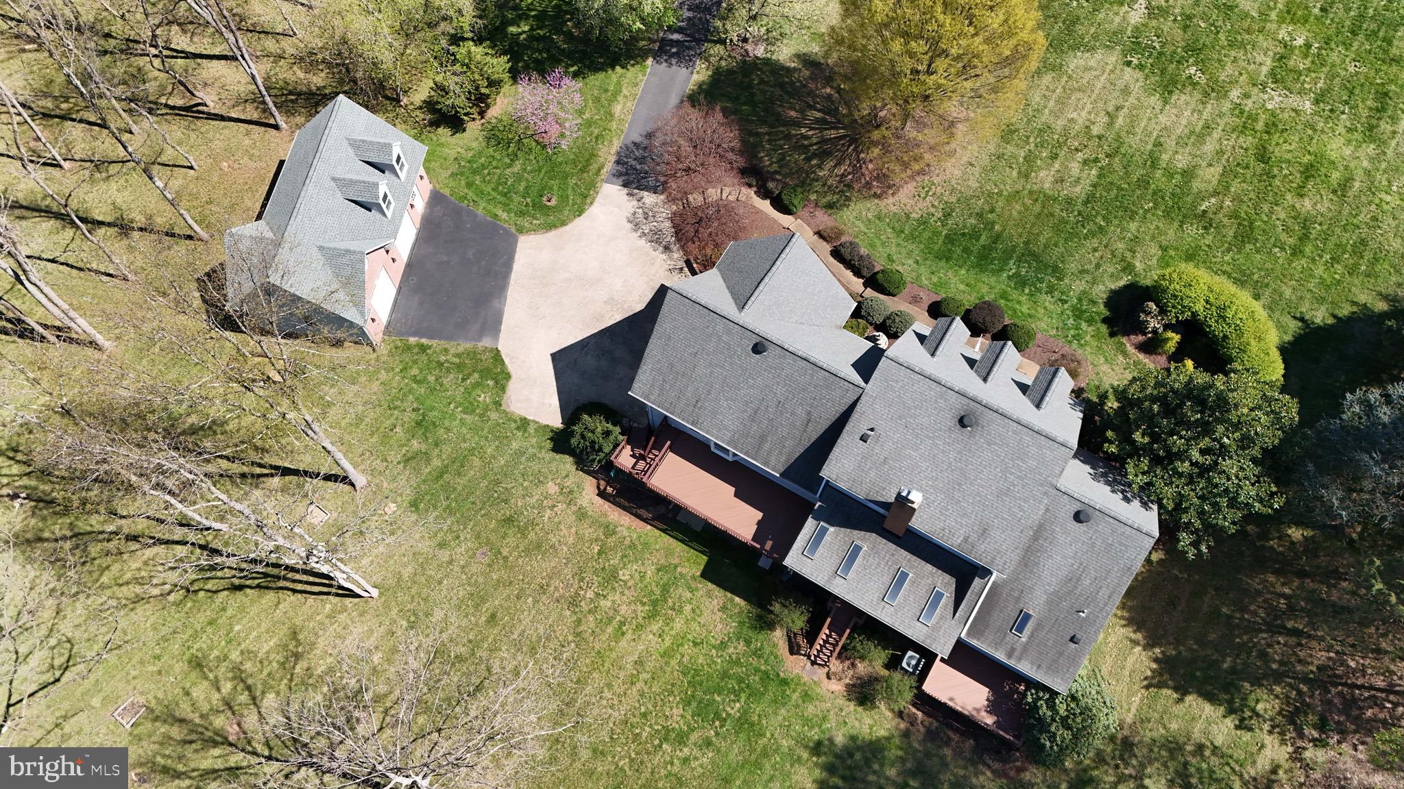41950 Saddlebrook Place Leesburg, VA 20176 - Photo 87 of 87 an aerial view of a house with a yard and trees