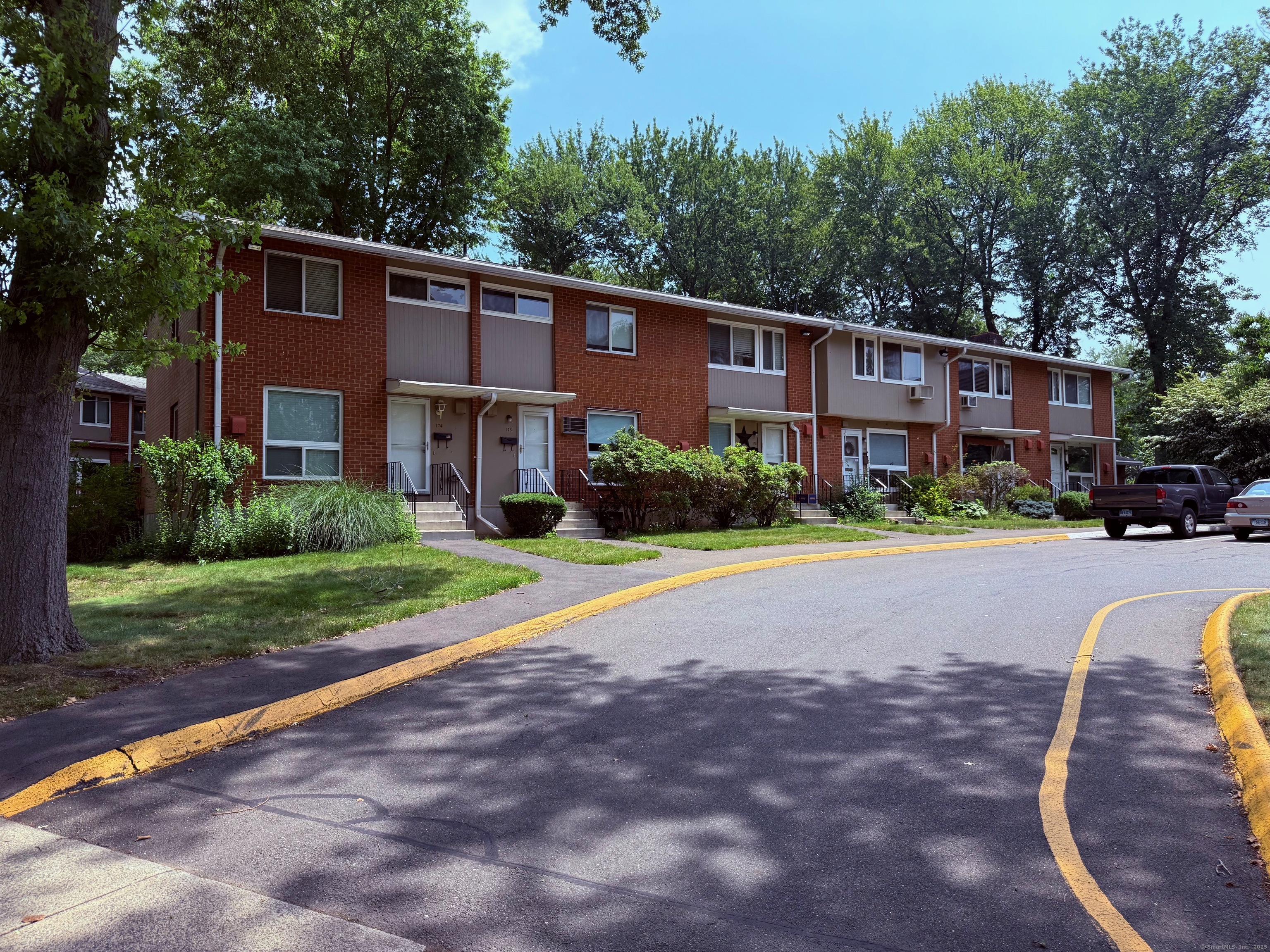 182 Worth Avenue Hamden, CT 06518 - Photo 1 of 36 a front view of a house with a yard and trees