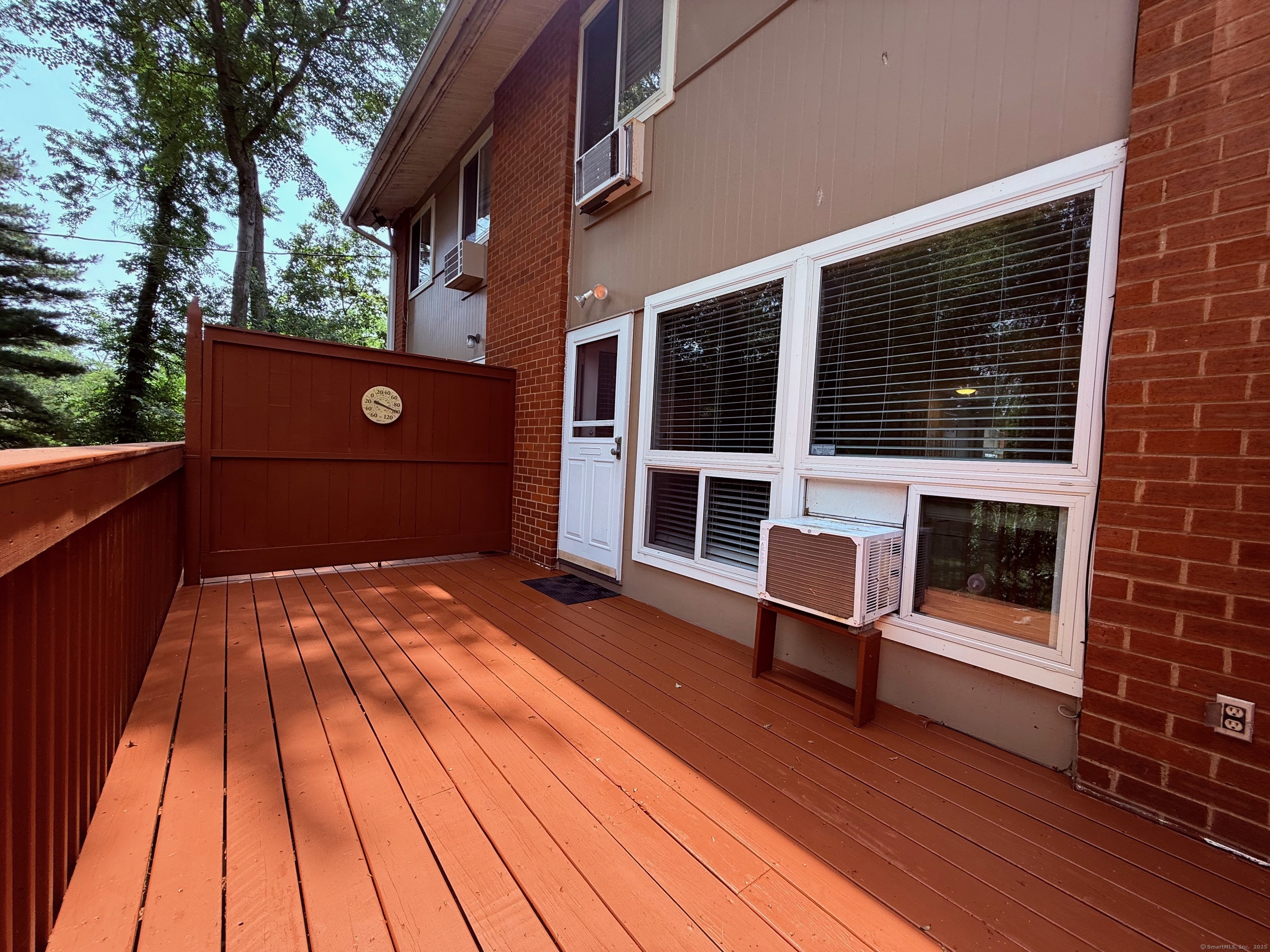 182 Worth Avenue Hamden, CT 06518 - Photo 14 of 36 a backyard of a house with wooden floor and seating space