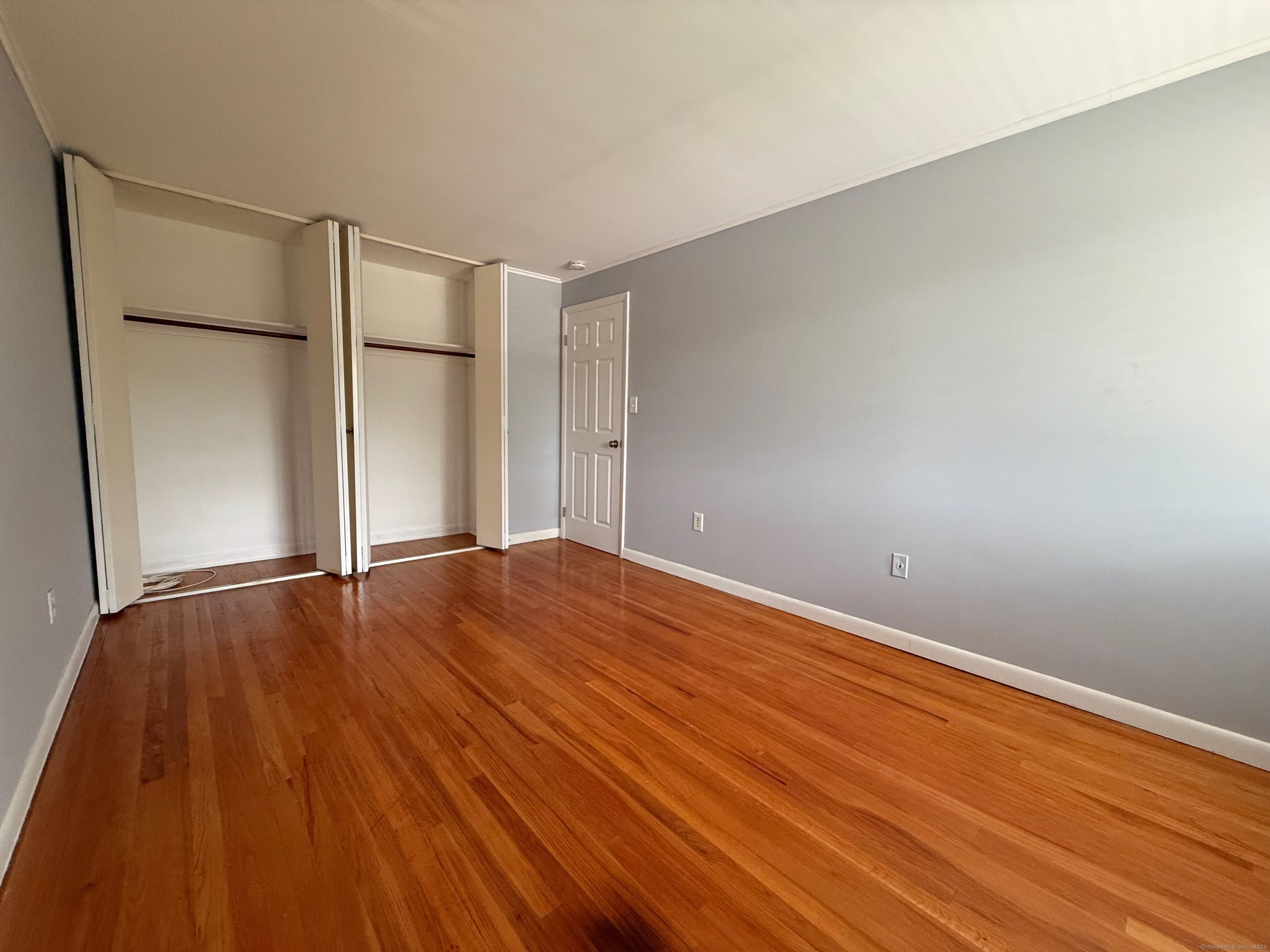 182 Worth Avenue Hamden, CT 06518 - Photo 16 of 36 a view of an empty room and wooden floor