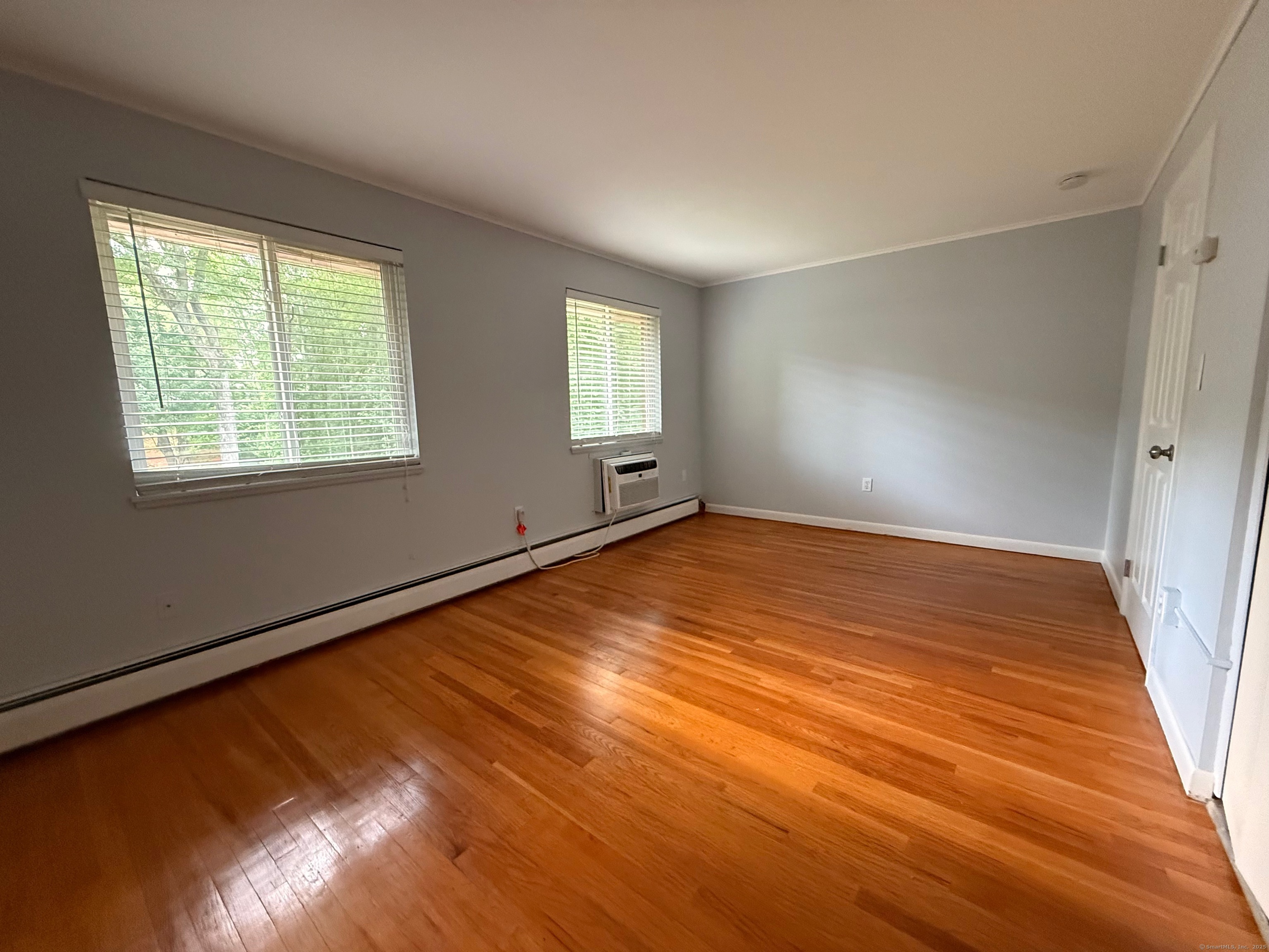 182 Worth Avenue Hamden, CT 06518 - Photo 20 of 36 a view of empty room with wooden floor and fan