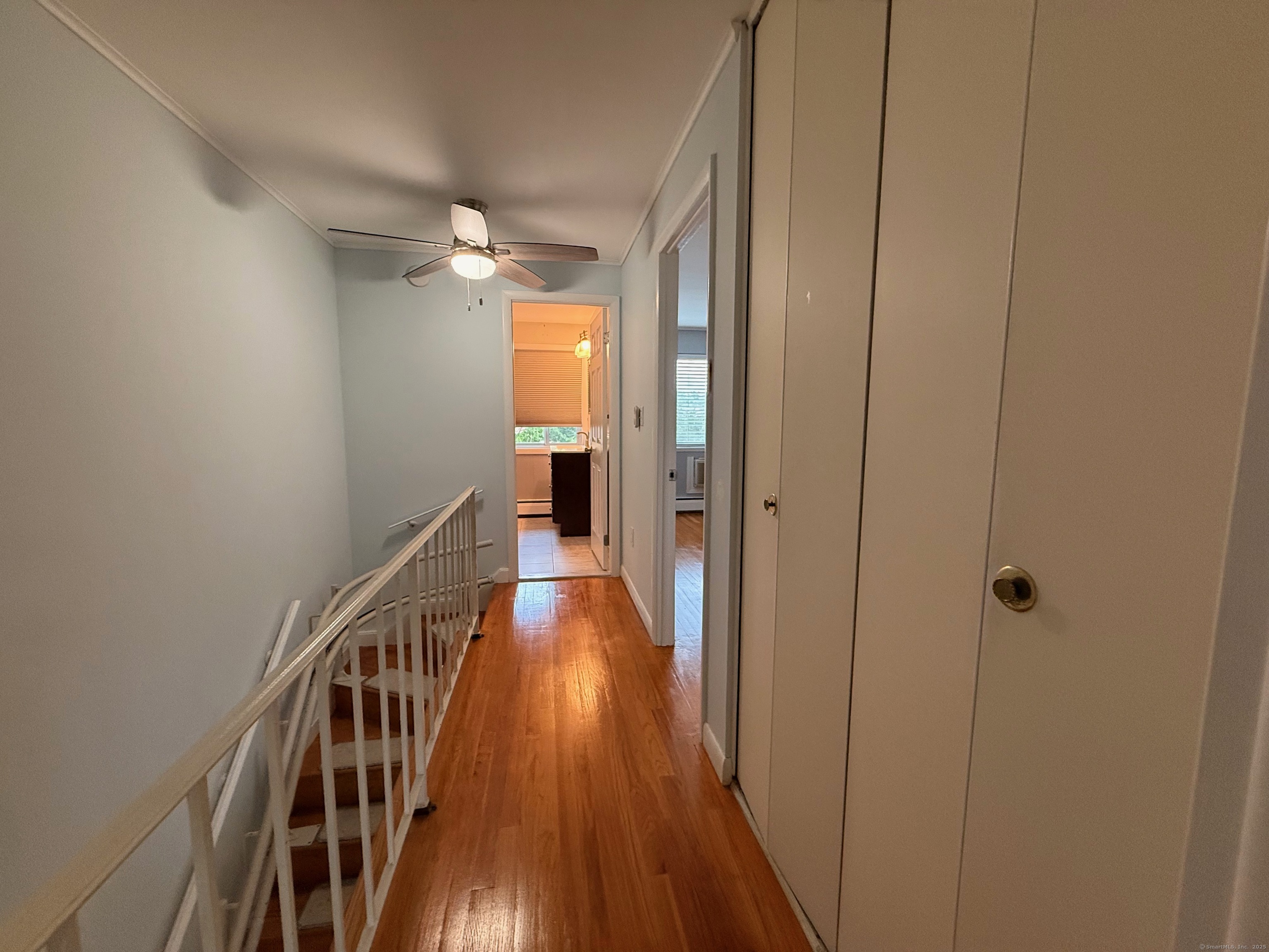 182 Worth Avenue Hamden, CT 06518 - Photo 24 of 36 a view of a hallway with wooden floor and staircase