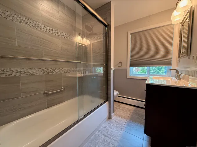 a bathroom with a bathtub and a sink