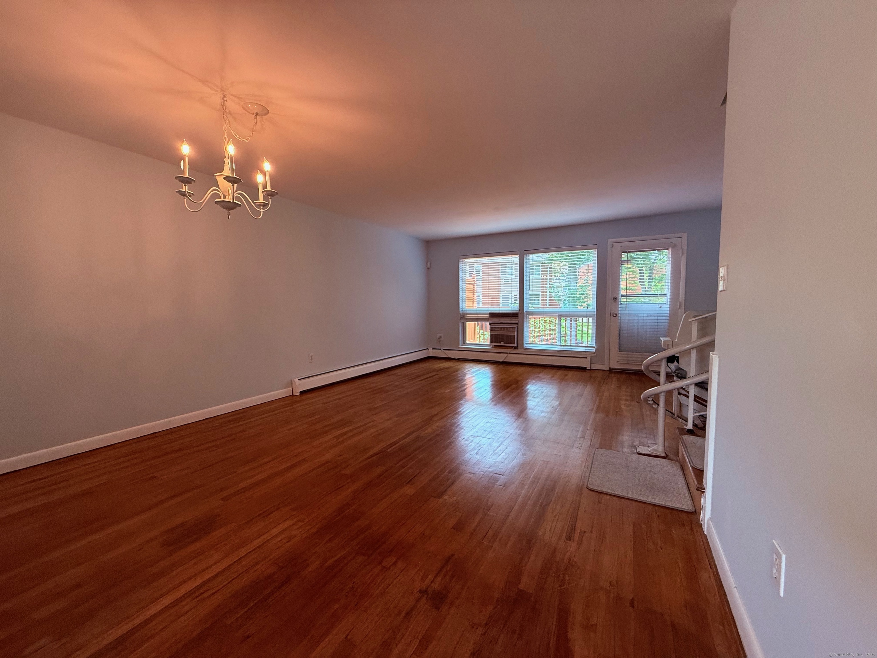 182 Worth Avenue Hamden, CT 06518 - Photo 10 of 36 a view of a room with wooden floor and window